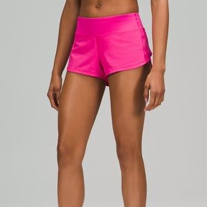 Bright pink Lululemon speed up low rise shorts